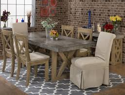 Our glass dining tables feature clear or grey glass that is 5/8 inches thick with flat polished edges. Boulder Ridge Concrete Dining Table W 6 X Back Chairs W Cushions 7pc75778wxbackchairwcushions Dining Room Groups Richey S Furniture