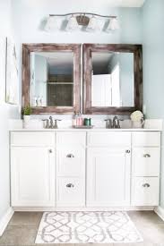 This off white vanity offers a ton of storage space and pairs well with an elegant lighting fixture. Master Bathroom Organization Ideas And Updates Abby Lawson