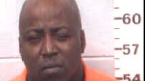 A woman is found shot to death inside a vehicle. Hours later, a Swainsboro  man is arrested