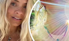 Holly Willoughby displays her healing crystal necklace after her family  holiday was cut short