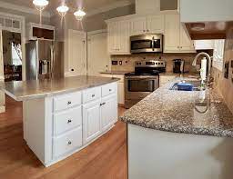 The dark marble island is made all the more dramatic against the white dove kitchen cabinets. White Dove Kitchen 2 Cabinet Girls