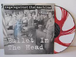 This time the bullet cold rocked ya a yellow ribbon instead of a swastika nothin' proper about ya propaganda fools follow rules when the set commands ya they said it was blue when the blood was red that's how you got a bullet blasted through ya head. Rage Against The Machine Bullet In The Head Colored Vinyl