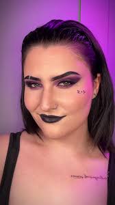 Rhea Ripley's Signature Purple and Black Makeup Look