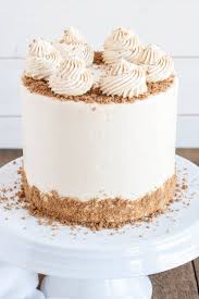 This Cookie Butter Cake Pairs Fluffy Vanilla Cake With A Sweet Cookie Butter Frosting And Crushed Speculoos Coo Biscoff Cake Summer Cake Recipes Butter Cookies
