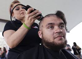 Students shave heads for cancer charity event