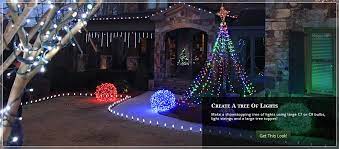 River rock along the border of the yard and heavy mulch are used instead of grass. Outdoor Christmas Yard Decorating Ideas