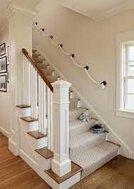 You can pull the rope tight or leave a lot of slack between poles depending on the look your are trying to achieve. Rope Staircase Railing By Wakefield Paint Stairway Design Staircase Design Staircase Remodel