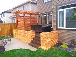 The 6x6x12s were extremely heavy, it's around 130 lb each when it is wet. Cedar Planters With Privacy Screen And Pergola American Craftsman Terrasse Edmonton Von Edmonton Custom Decks Houzz