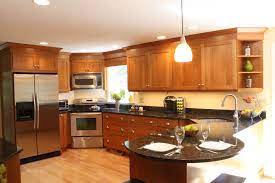Black stainless lets the wood take center stage while still providing an upscale look. Cherry Wood Cabinet Kitchen Stainless Steel Appliances Corner Sink And Corner Range Open Corn Kitchen Cabinets Transitional Kitchens Kitchen Renovation Cost