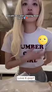 Rosé with her T-Shirt Unboxing 'Rosie' merch—shop now before our limit...