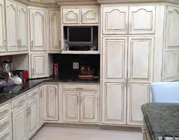 If your kitchen needs a refresh, look to your cabinets. B G Studios Faux Finish