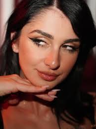 Everybody's looking at me But that's alright, I like attention The clubs  not hot, until I walk through They stop and stare and watch me move