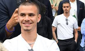 Romeo Beckham joins the stars at Centre Court as he cheers Emma Raducanu to  victory against Elise Mertens