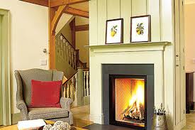 Cy started the project by building a frame above the mantle ledge to create a flat surface between the two places where the brick stuck out. How To Reface A Fireplace Surround And Hearth This Old House