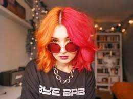 Split Dyed Hair Orange And Red Split Dyed Hair Dyed Hair Hair Color Orange