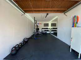 This ceiling mount pull up bar consists of two silver steel bars that mount to the ceiling, with a single black steel bar held in. Low Ceiling Garage Gym Gym Design Interior Home Gym Garage Garage Gym