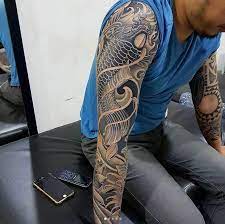 Black And Grey Ink Koi Sleeve By Van Drago Dragonkoifishtattoodesigns Koi Fish Tattoo Koi Tattoo Tattoos
