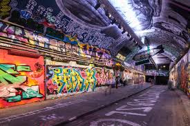 People walking in metro tunnel in paris. Leake Street Arches South Bank London