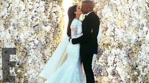 Kim's givenchy wedding gown hangs beside a matching version for daughter north west. First Kim Kardashian Kanye West Wedding Photos Released Abc News