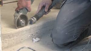 Hold the grinder away from you, make contact with the concrete and then pull the grinder towards you in a smooth, slow and consistent manner. Worker Cutting The Concrete Slab Stock Footage Video 100 Royalty Free 1022083537 Shutterstock