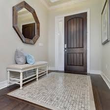 Peter bennetts design ideas for a large contemporary foyer in melbourne with grey walls, black floor and painted wood floors. How To Create A Tile Rug In Your Home Tile Outlets Of America