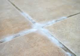 If you don't want to use a chemical floor tile grout cleaner, mix a solution with one part vinegar and one part water. Does Cleaning Grout With Baking Soda And Vinegar Really Work