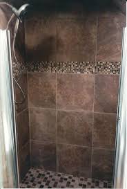 Dark Brown Tiled Shower With Glass Mosaic Accents And Porcelain Mosaic Floor Brown Tile Shower Shower Tile Kitchen And Bath