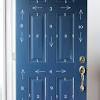 Start painting your door by painting the details of the door first. 1