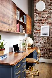 Home Office With Exposed Brick Wall And Navy Cabinets Home Office Decor Office Wall Cabinets Home Office Design