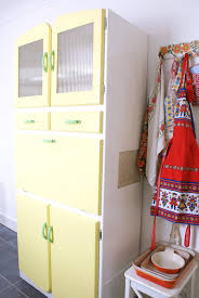 Bring a hint of whimsy when organizing your home space with this ash grey vintage storage cabinet. Messyjesse Vintage Cabinet Vintage Cabinets Vintage Kitchen Vintage Kitchen Cabinets