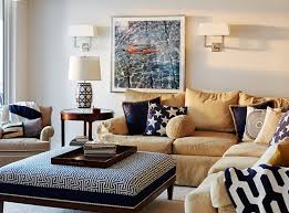 Make a room light and inviting by using soft blue walls with creamy white details and orange accents. 20 Appealing Living Rooms With Gold And Navy Accents Home Design Lover