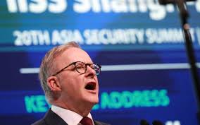 U.S., China defense chiefs shake hands at security…