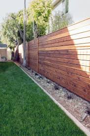 Using a window frame on the garden fence gives the garden a charming look. Top 50 Best Backyard Fence Ideas Unique Privacy Designs