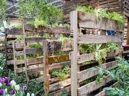 Vertical Gardening A Combination Of Pots And Landscape Fabric Filled With Planting Medium To Create Vertical Garden Vertical Herb Garden Vertical Garden Diy