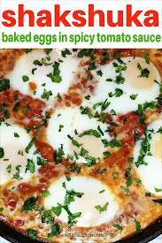 Shakshuka Baked Eggs In Spicy Tomato Sauce Spicy Egg Dish Usually Served For Breakfast Shakshuka Baked Eggs Spicy Eggs