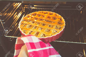 fresh baked golden apple pie in red