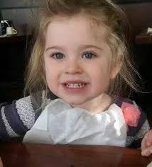 Can someone remove the napkin from the baby?