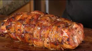 Roasting a boneless pork loin roast slowly will guarantee moist, tender meat. Bacon Wrapped Peach Glazed Pork Loin On The Rotisserie With The Meater Youtube
