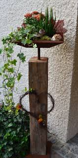 Altholzbalken Mit Edelrost Schale Und Bodenplatte Eckig Altholzbalken Bodenplatte Eckig Edelrost Schale Metall Gartenkunst Baumstamm Deko Und Gartendeko Holz