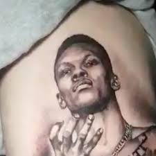 We have got 25 pics about israel adesanya tattoos images, photos, pictures, backgrounds, and more. The Weekly Grind Fan Gets Giant Israel Adesanya Tattoo Max Holloway Pranks Friend Mma Fighting