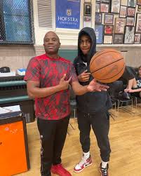 Coach Straker with Wyndanch (L.I.) H.S. Jaden Mack-Curry