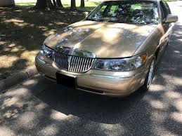 Image result for Medium Gold 1998 Town Car