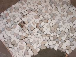 Install the tile in small sections. Pebble Shower Floors For Tiled Showers How To Install Small Rocks Tile Your World