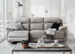 Wood, rugs, artwork, and furniture in light shades, against dark gray walls, create a living room landscape with depth and interest. Keep It Classic 7 Grey And Brown Living Room Ideas Furniture Village
