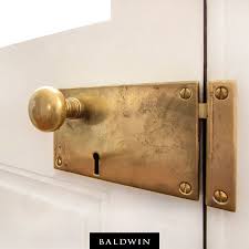 Our Horizontal Rim Lock In Vintage Brass Adds A Rustic Look To This Creole Style Home Credit J E Schr Home Hardware Rustic House Traditional Interior Design