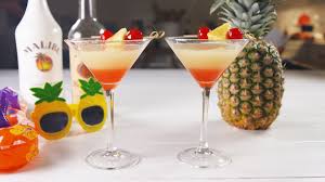 A summer drink with malibu® rum, sprite®, pineapple juice, and o.j. 11 Tropical Coconut Rum Drinks To Try Now
