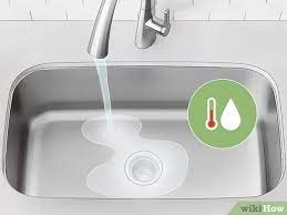 Stagnant food in your kitchen drain can cause a foul smell that soon fills up the entire room. 4 Ways To Clean A Smelly Drain Wikihow