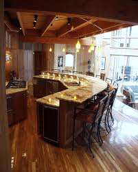 Wide Open Kitchen With Bar Seating As Well As Tables Encourages Conversation Curved Kitchen Kitchen Bar Design Curved Kitchen Island