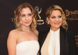 Starting at the front, take a small section of hair and place the ends at the base of your curling iron barrel and then wrap the hair up around the barrel until you reach your roots. Candace Cameron Bure S Daughter Is All Grown Up And Looks Just Like Her