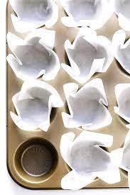 Press the sides of the parchment paper down around the mold, creasing the pleats with your hand. How To Make Parchment Baking Liners Gimme Some Oven